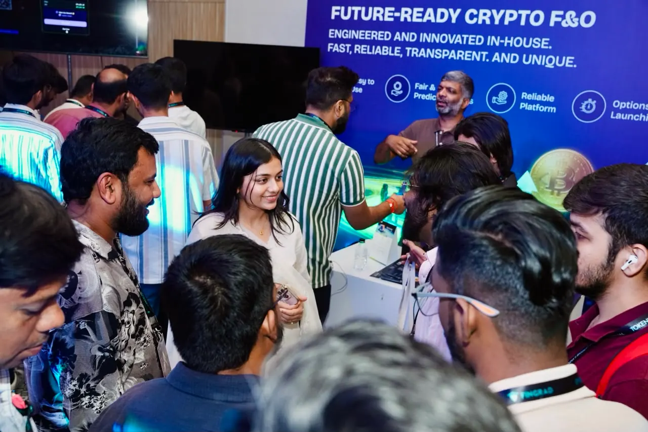 A group listens to a walkthrough at an exchange stand