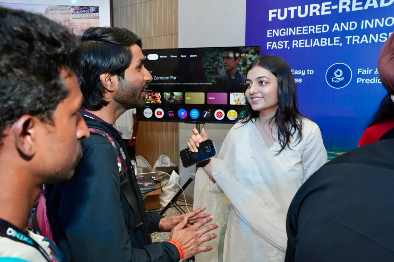 Attendees look on as a platform feature is demonstrated