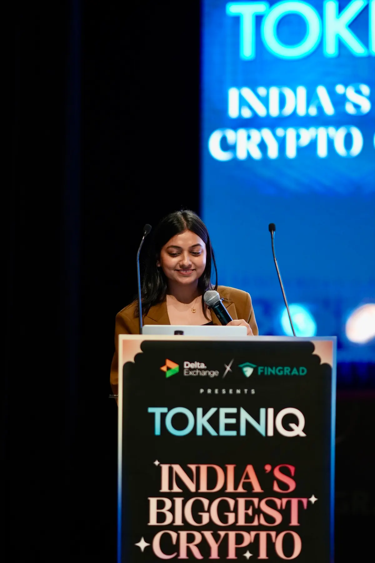 A speaker at the podium during a conference keynote