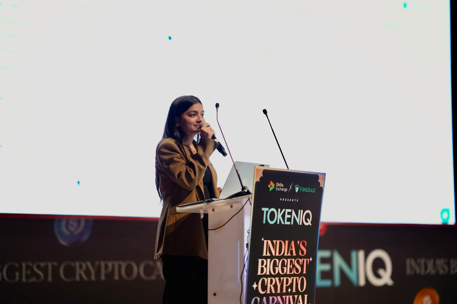 A speaker at the lectern addressing the hall
