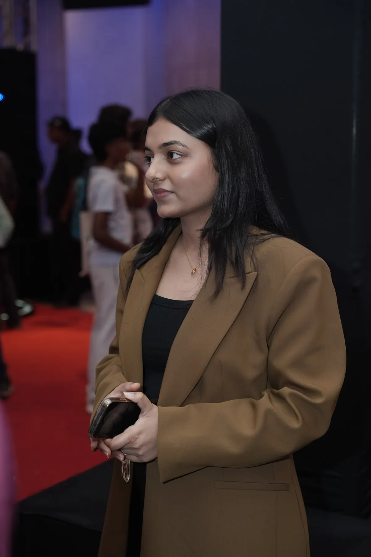 A speaker steps away from the stage after a session