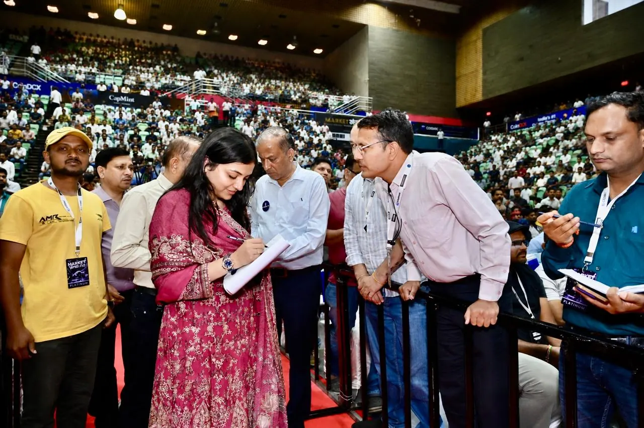 A speaker takes questions from attendees on the floor