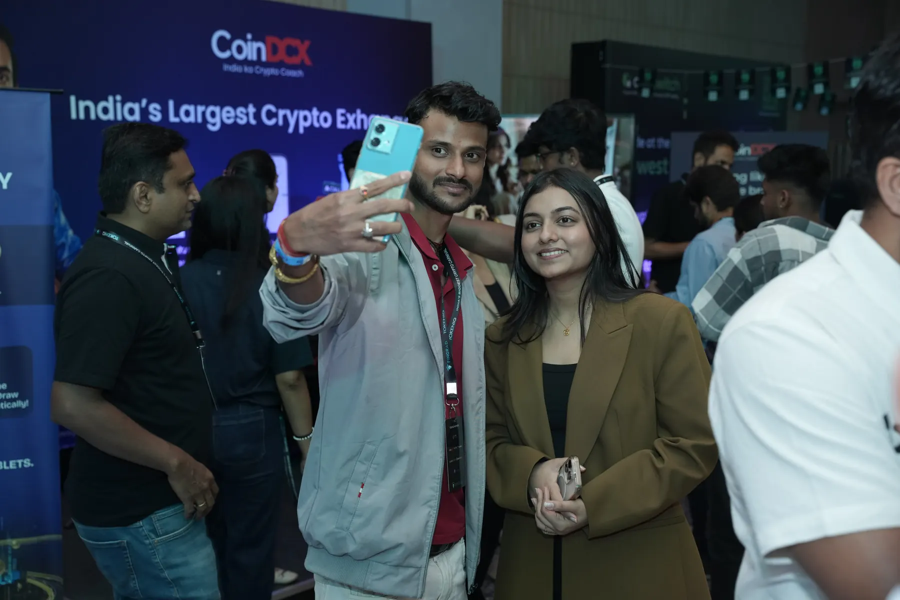 An attendee takes a photo at the exchange stand