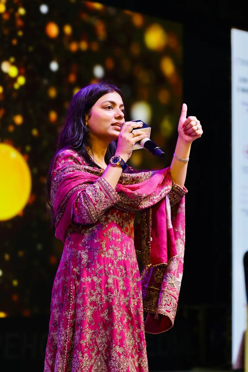 A speaker mid-sentence during a live market session